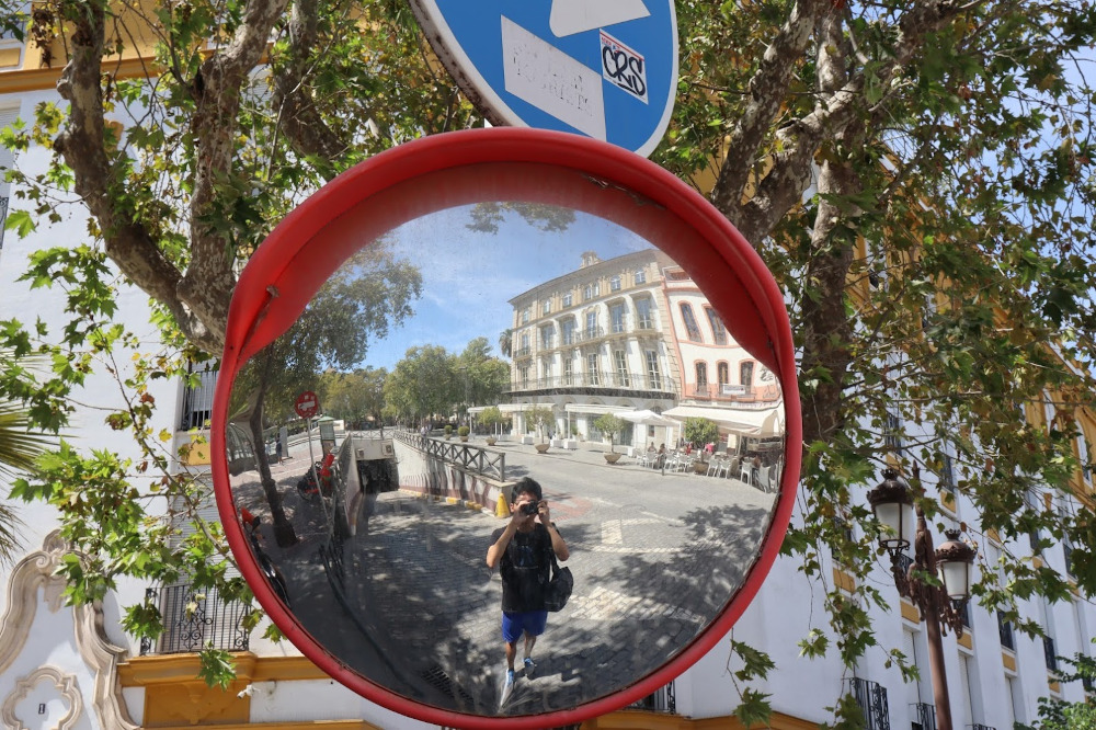 A picture of a street mirror in Seville.